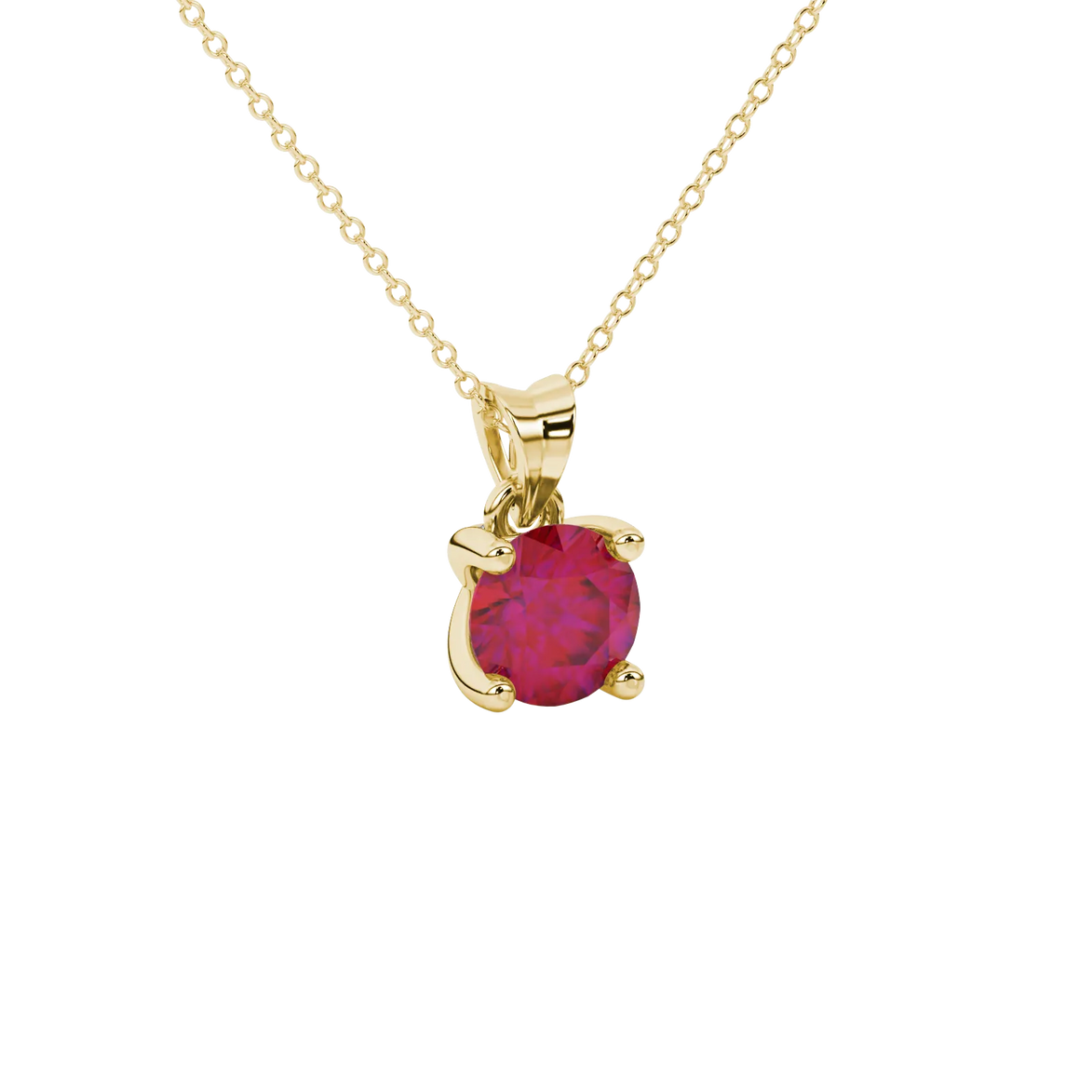 close-up of a round-cut raspberry red gemstone surrounded by a yellow gold surprise diamond pendant.