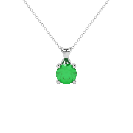 Round-cut emerald green gemstone pendant in a white gold surprise diamond setting.