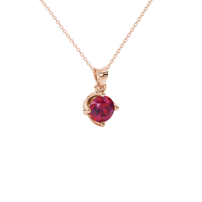 Close-up shot of a round raspberry red gemstone pendant with a rose gold tulip basket design.