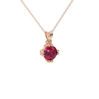 close-up shot of a round raspberry red gemstone pendant with a rose gold vintage basket design.