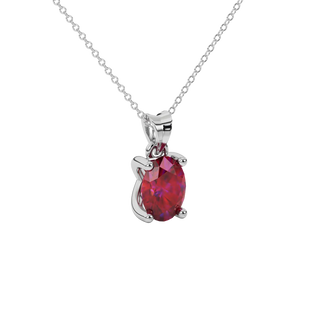 Close-up oval cut raspberry red gemstone pendant, white gold four prong setting.
