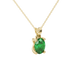 Close-up, oval cut emerald green gemstone, yellow gold four prong pendant.