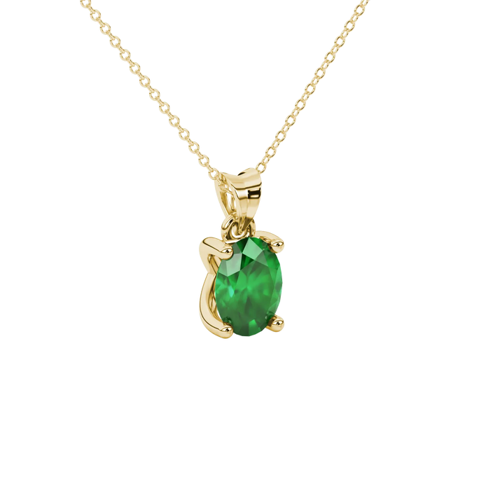 Close-up, oval cut emerald green gemstone, yellow gold four prong pendant.