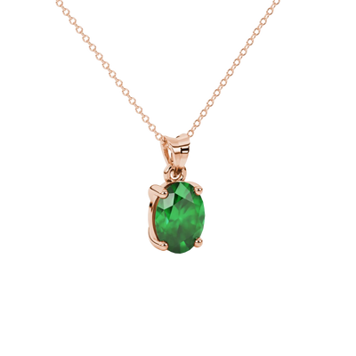 Close-up, oval cut emerald green gemstone pendant, rose gold classic basket.