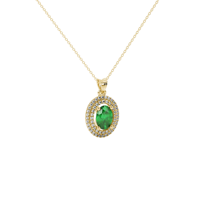 Close-up, oval cut emerald green gemstone, yellow gold falling edge halo pendant.