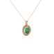 Close-up, oval cut emerald green gemstone pendant, rose gold double halo.