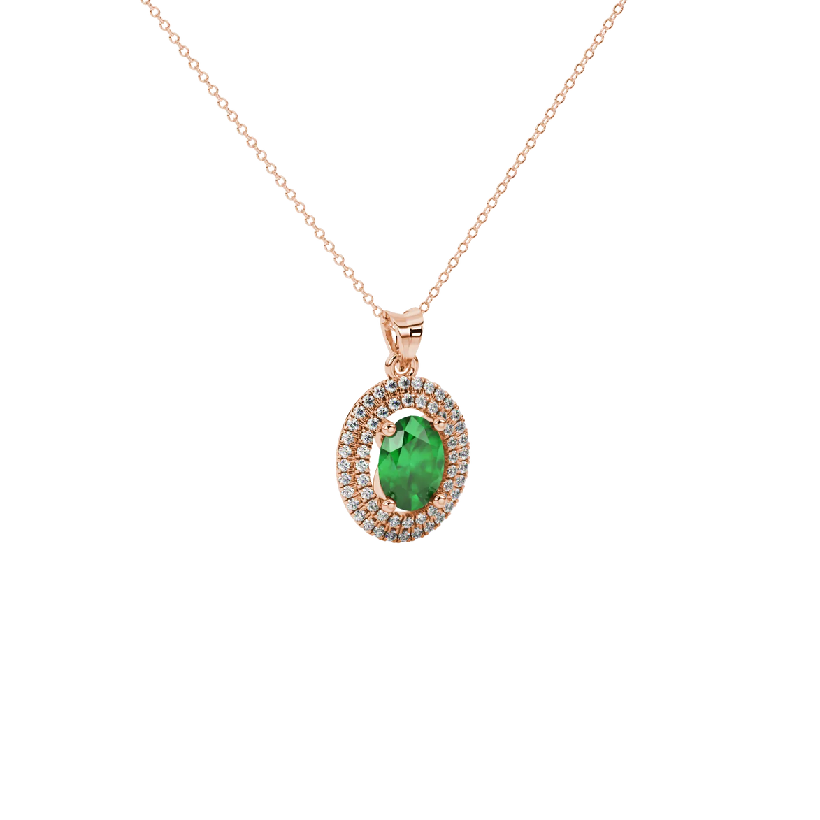 Close-up, oval cut emerald green gemstone pendant, rose gold double halo.