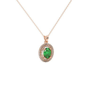Close-up, oval cut emerald green gemstone pendant, rose gold double halo.