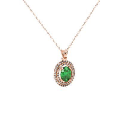 Close-up, oval cut emerald green gemstone pendant, rose gold double halo.