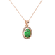 Close-up, oval cut emerald green gemstone pendant, rose gold french pavé halo.