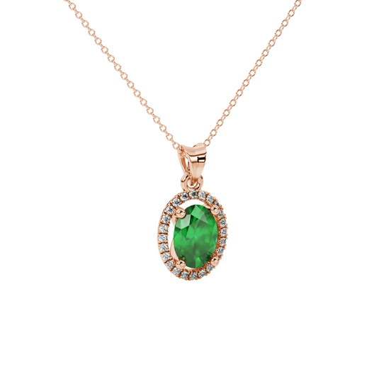 Close-up, oval cut emerald green gemstone pendant, rose gold french pavé halo.