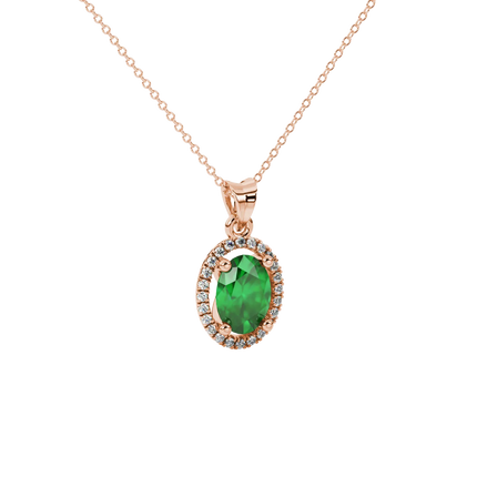 Close-up, oval cut emerald green gemstone pendant, rose gold french pavé halo.