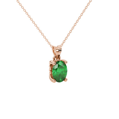 Close-up, oval cut emerald green gemstone pendant, rose gold lotus basket.
