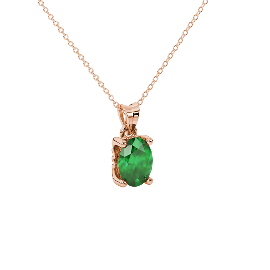 Close-up, oval cut emerald green gemstone pendant, rose gold lotus basket.