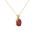 Close-up, oval cut raspberry red gemstone, yellow gold lotus basket pendant.