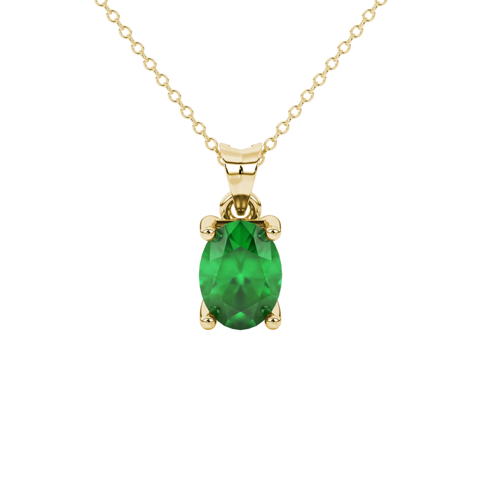 Oval cut emerald green gemstone pendant, yellow gold surprise diamond settin