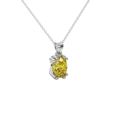 Close-up oval cut canary yellow gemstone pendant, white gold vintage basket.