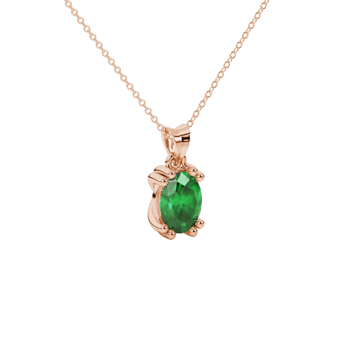 Close-up, oval cut emerald green gemstone pendant, rose gold vintage basket.