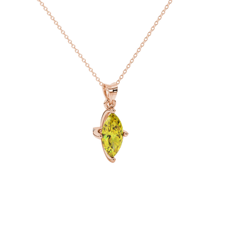Close-up, marquise cut canary yellow gemstone pendant, rose gold surprise diamond setting.