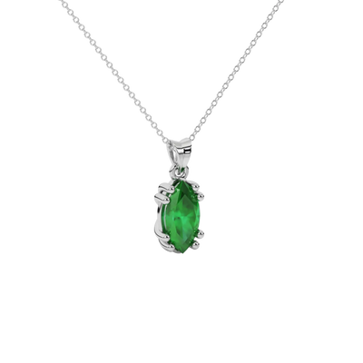 Close-up marquise cut emerald green gemstone, white gold vintage basket.