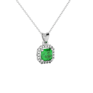 emerald green gemstone halo pendant in white gold
