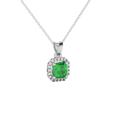 emerald green gemstone halo pendant in white gold
