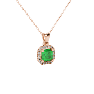 emerald green gemstone halo pendant in rose gold
