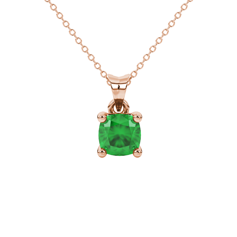 Green cushion cut gemstone solitaire pendant in gold featuring a refined four-prong basket setting