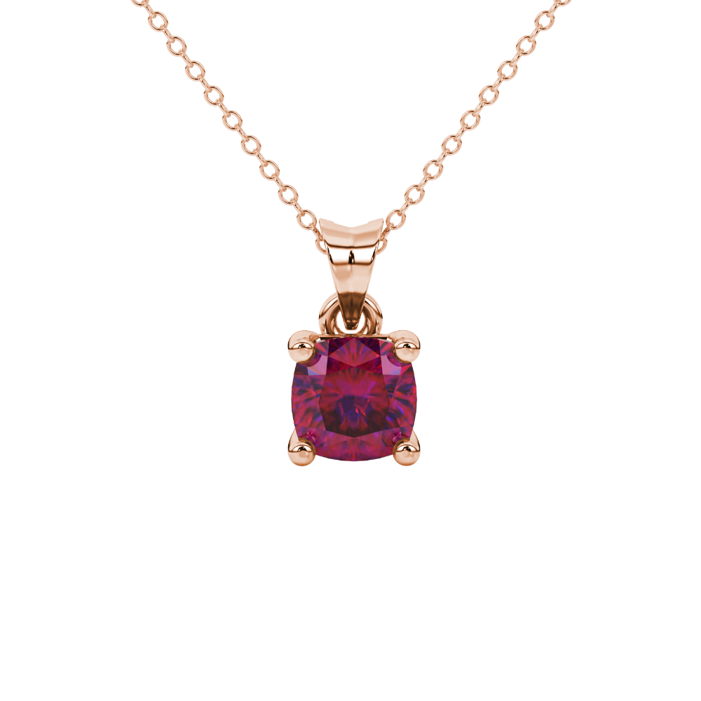 Red cushion cut gemstone solitaire pendant in gold featuring a refined four-prong basket setting
