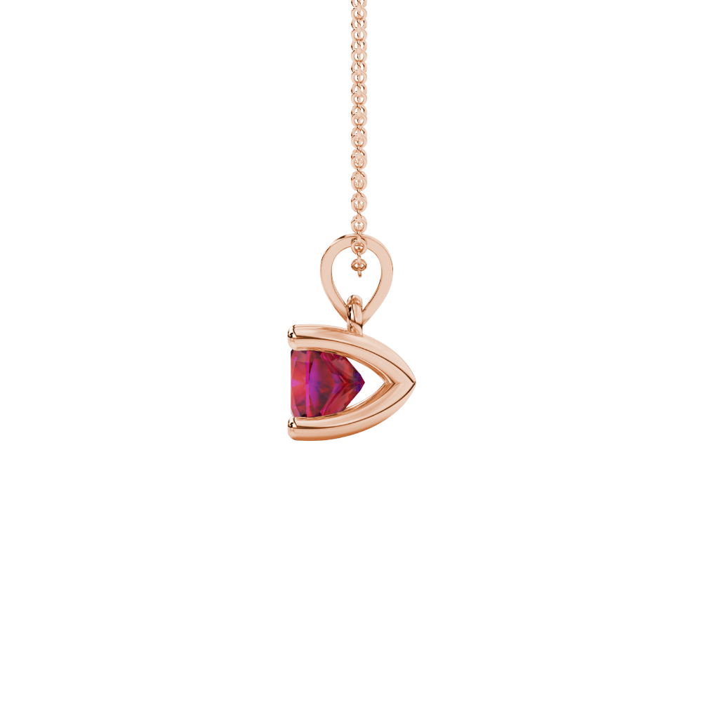 Red cushion cut gemstone solitaire pendant in gold featuring a refined four-prong basket setting