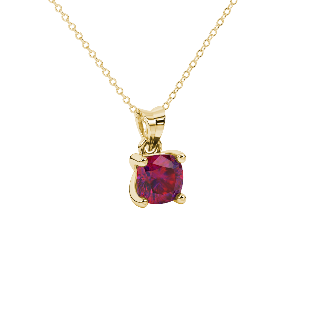 Red cushion cut gemstone solitaire pendant in gold featuring a refined four-prong basket setting