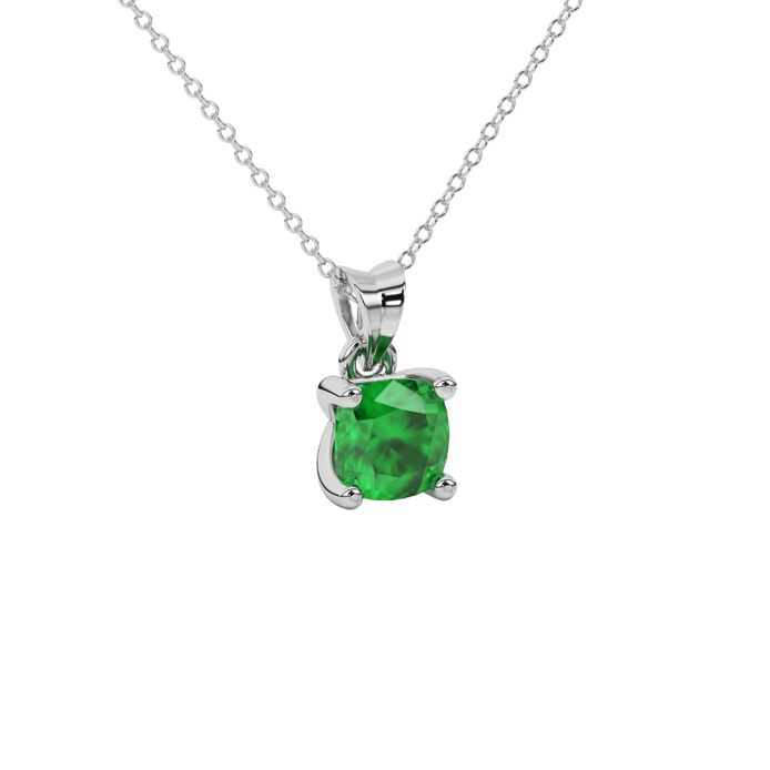 Green cushion cut gemstone solitaire pendant in gold featuring a refined four-prong basket setting