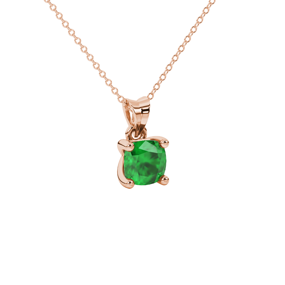 Green cushion cut gemstone solitaire pendant in gold featuring a refined four-prong basket setting