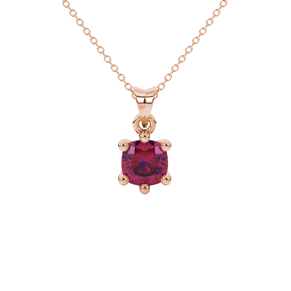 Red cushion cut gemstone solitaire pendant in gold featuring a refined six-prong basket setting