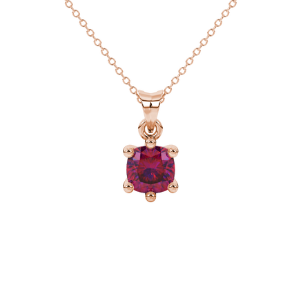 Red cushion cut gemstone solitaire pendant in gold featuring a refined six-prong basket setting
