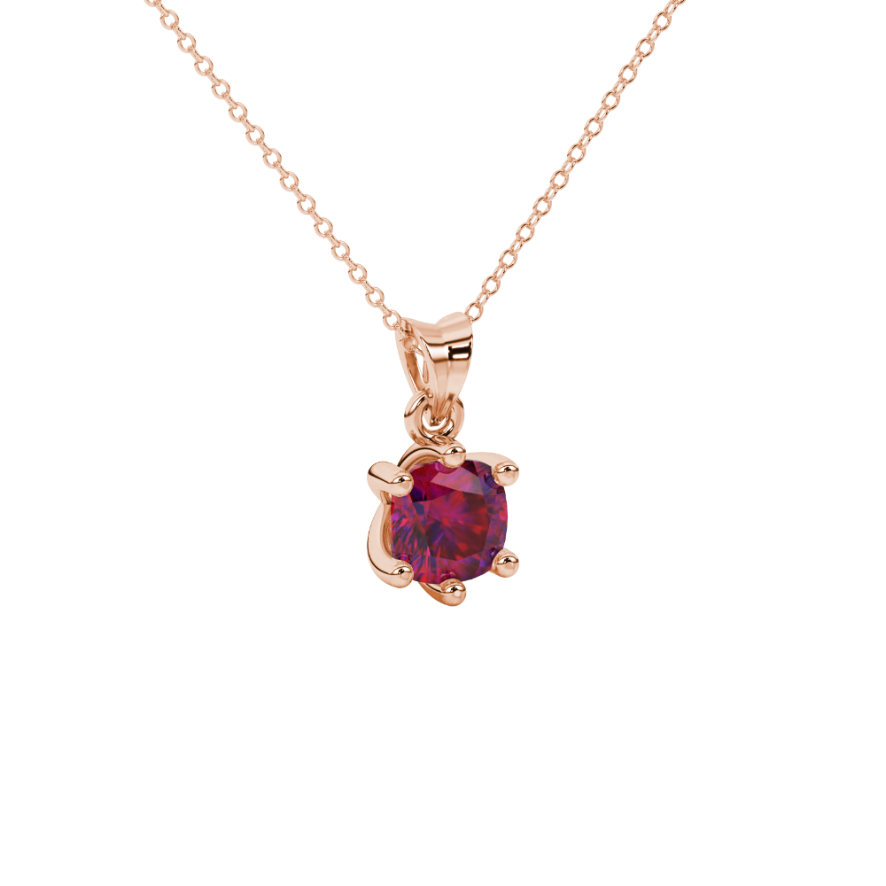 Red cushion cut gemstone solitaire pendant in gold featuring a refined six-prong basket setting