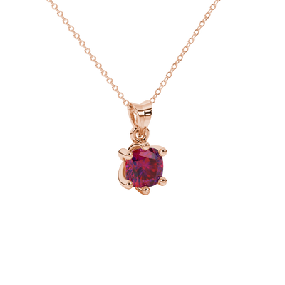 Red cushion cut gemstone solitaire pendant in gold featuring a refined six-prong basket setting