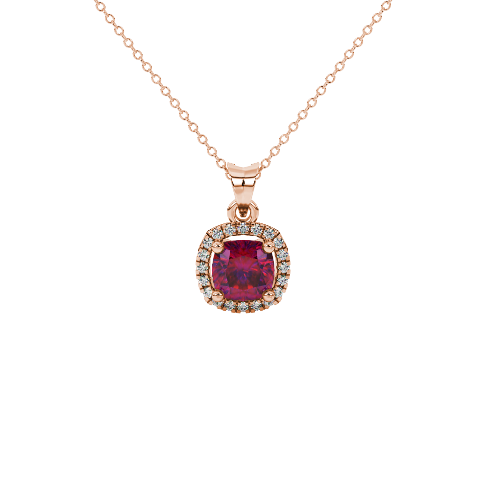 Red cushion cut gemstone halo pendant with diamond accents in gold