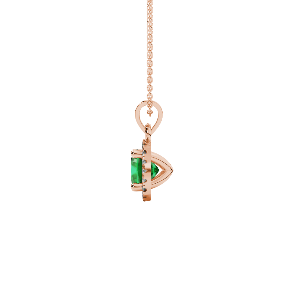 Green cushion cut gemstone halo pendant with diamond accents in gold
