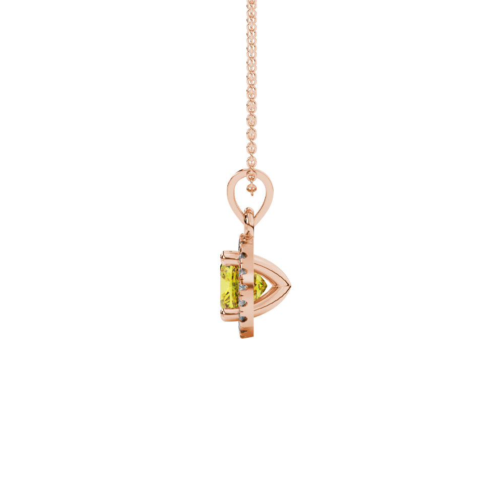 Yellow cushion cut gemstone halo pendant with diamond accents in gold