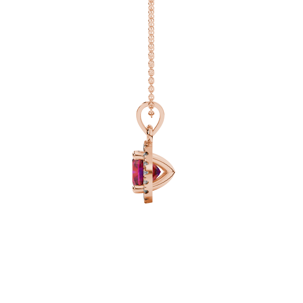 Red cushion cut gemstone halo pendant with diamond accents in gold