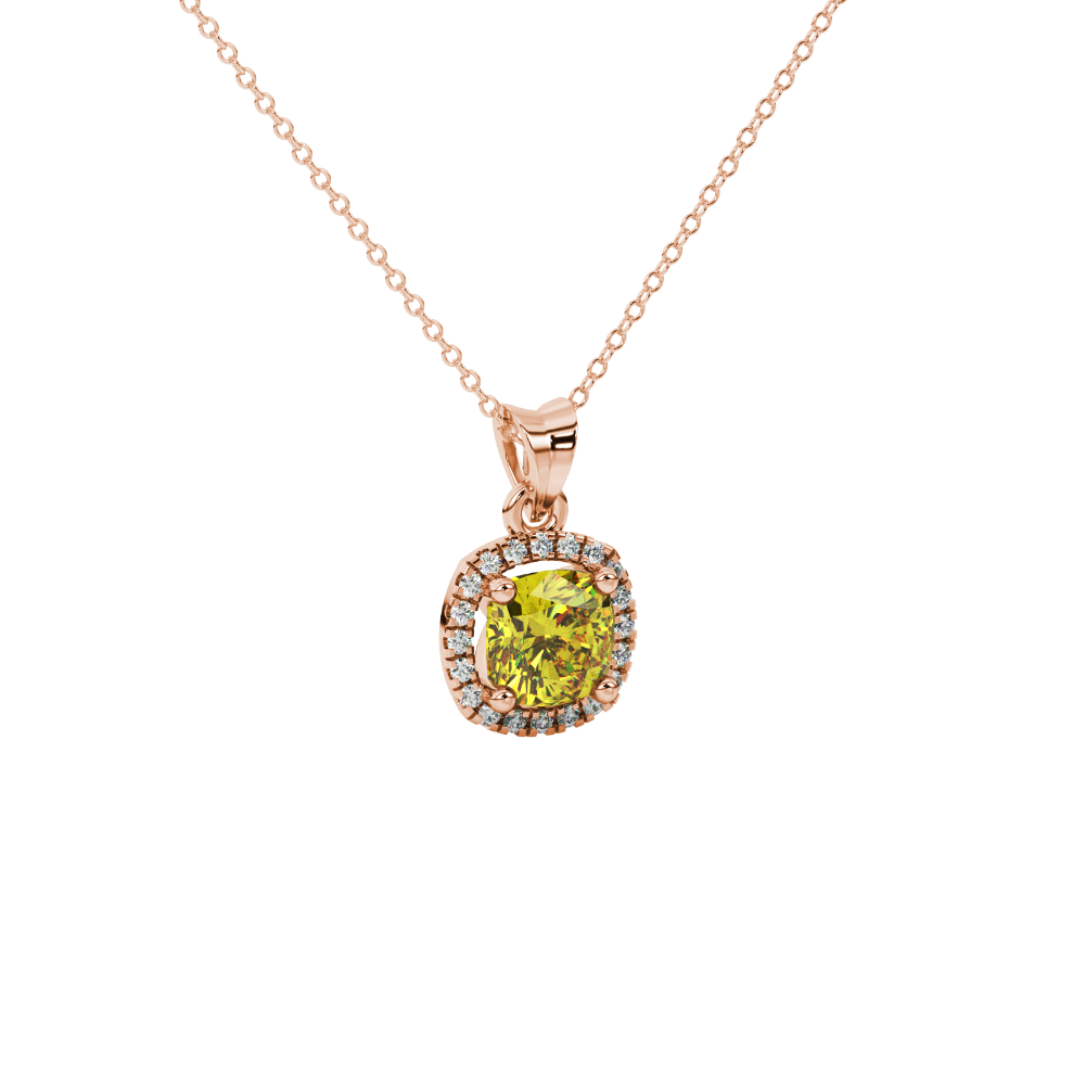 Yellow cushion cut gemstone halo pendant with diamond accents in gold