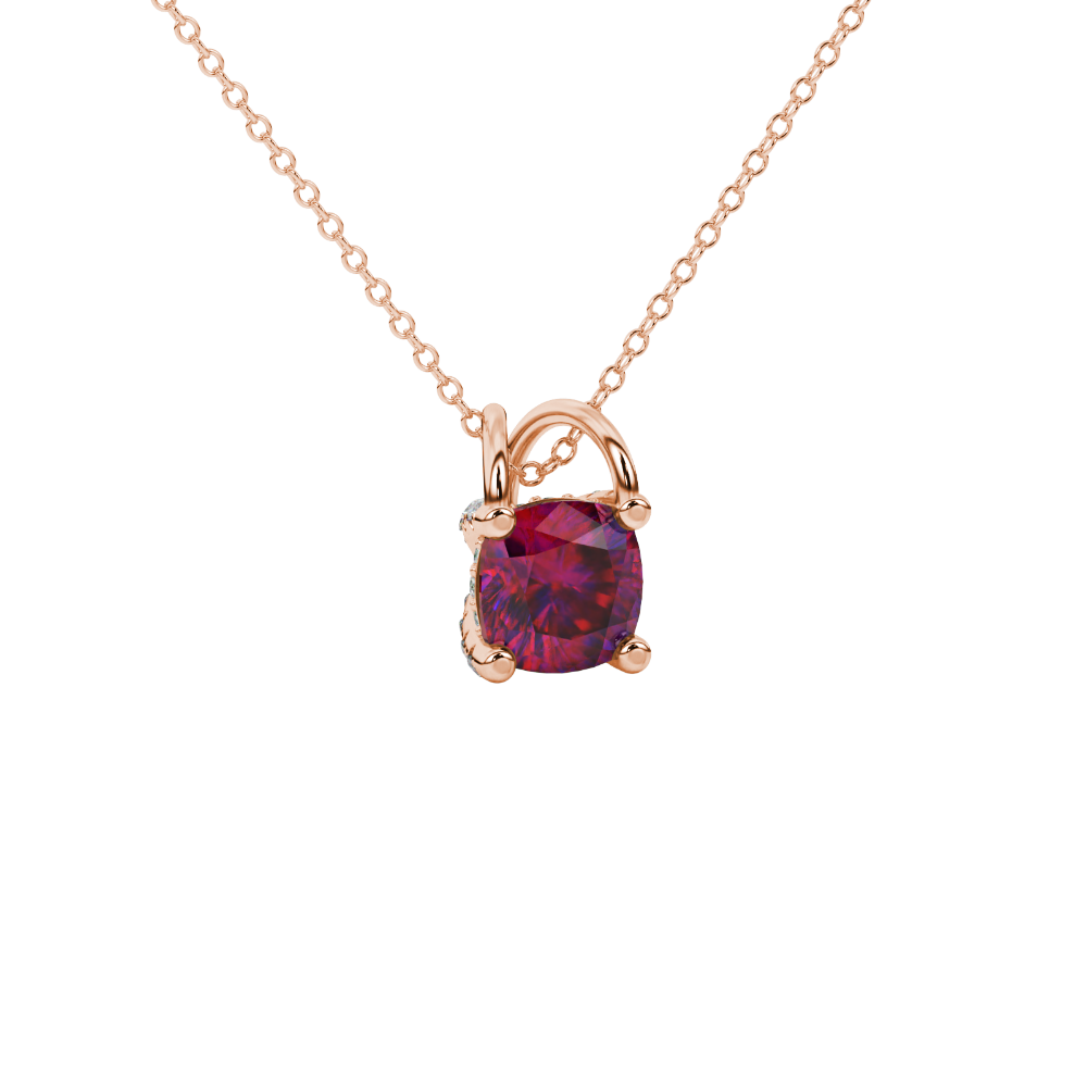 Red cushion cut gemstone pendant with diamond accent basket setting in rose gold