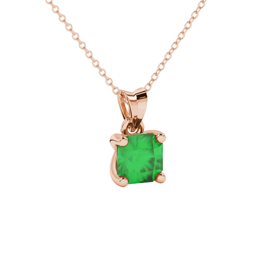 close-up shot of a radiant emerald green gemstone pendant with a classic rose gold four-prong setting.