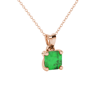 close-up shot of a radiant emerald green gemstone pendant with a classic rose gold four-prong setting.
