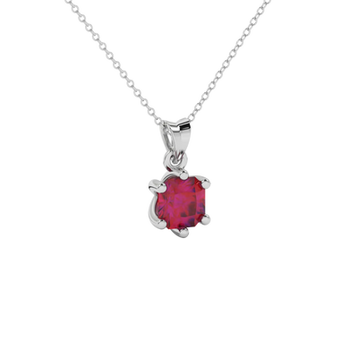 close-up of a radiant raspberry red gemstone enclosed in a white gold six-prong pendant setting.