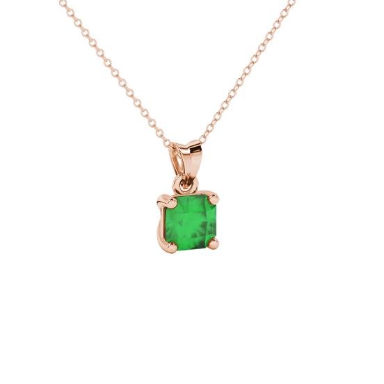 close-up shot of a radiant emerald green gemstone pendant with a rose gold classic basket gallery.