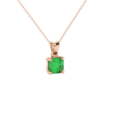 close-up shot of a radiant emerald green gemstone pendant with a rose gold classic basket gallery.