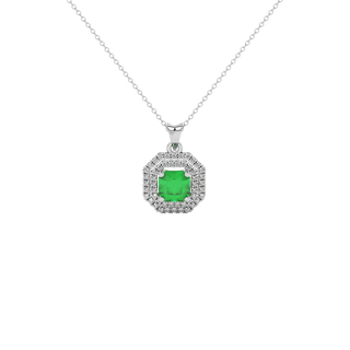 Radiant-cut emerald green gemstone pendant in a white gold falling edge halo setting