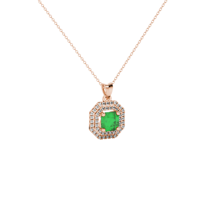 close-up shot of a radiant emerald green gemstone pendant with a rose gold halo gallery.